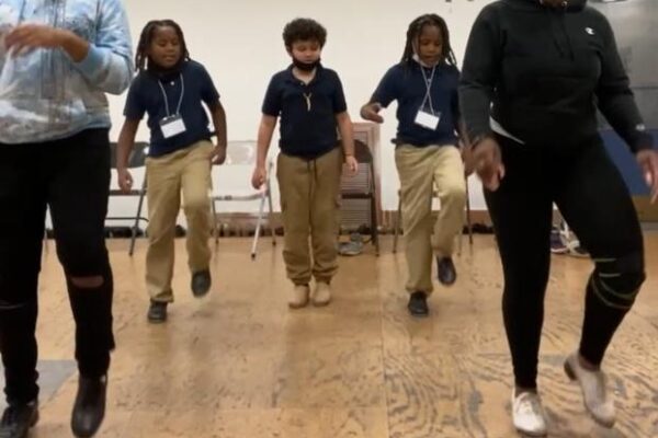 2022 Tapology Outreach Director Shanzell Page teaches choreography to children at the Sylvester Broome Dance Center